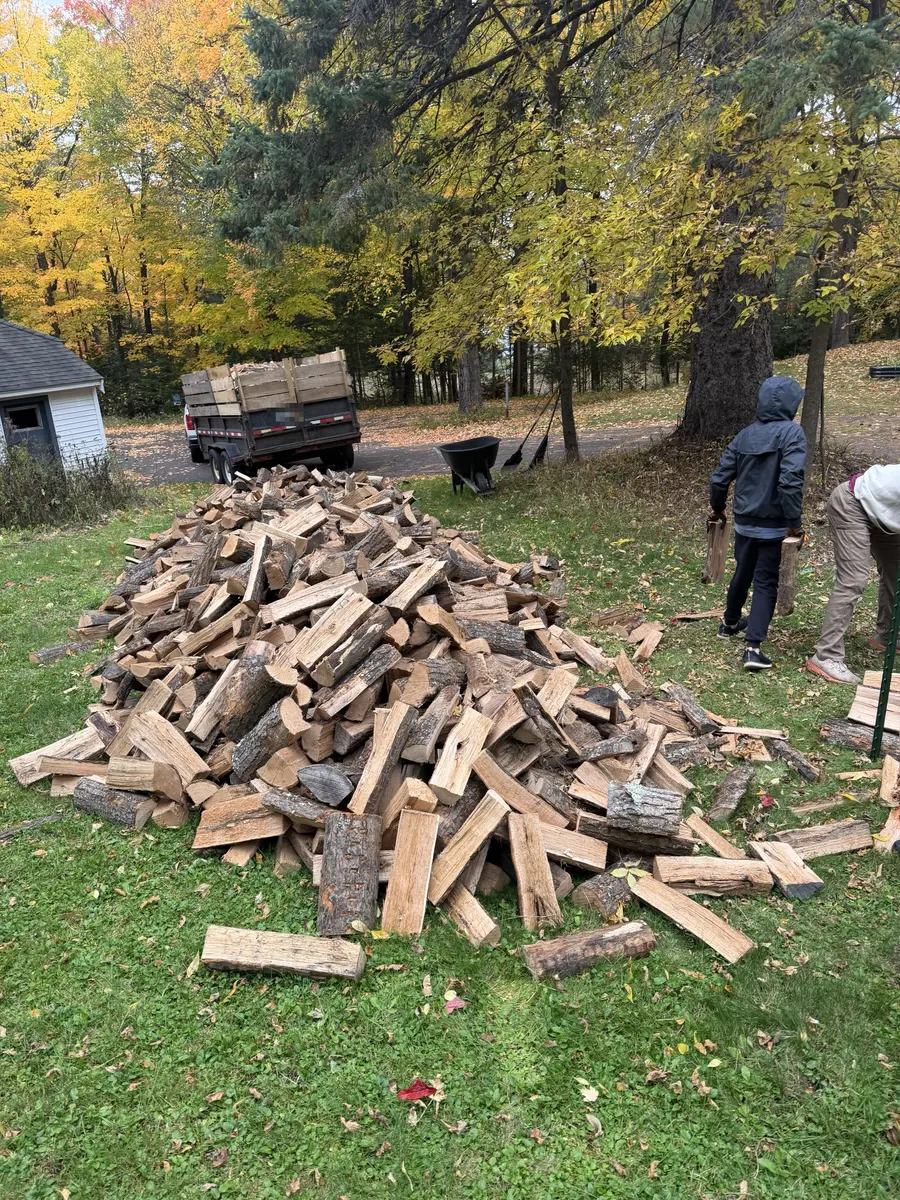 Martens Firewood dump trailer after unloading three full cords of oak on a customer's lawn
